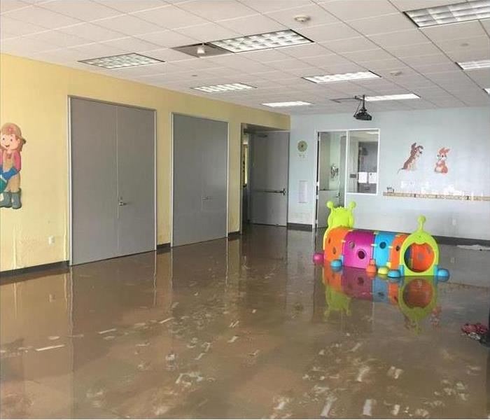 Daycare room with water on the floor
